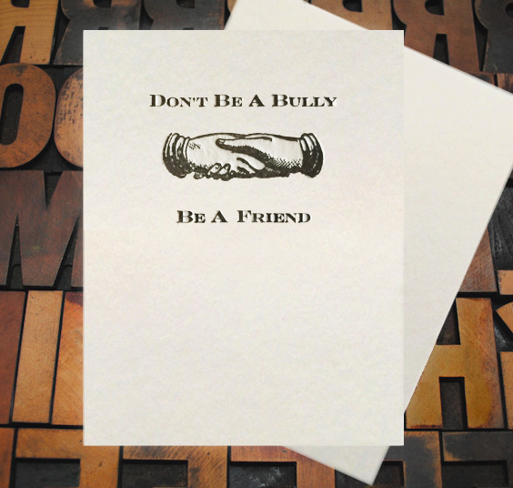 Letterpress Card with an image of two hands shaking and the text, "Don't be a bully, be a friend"